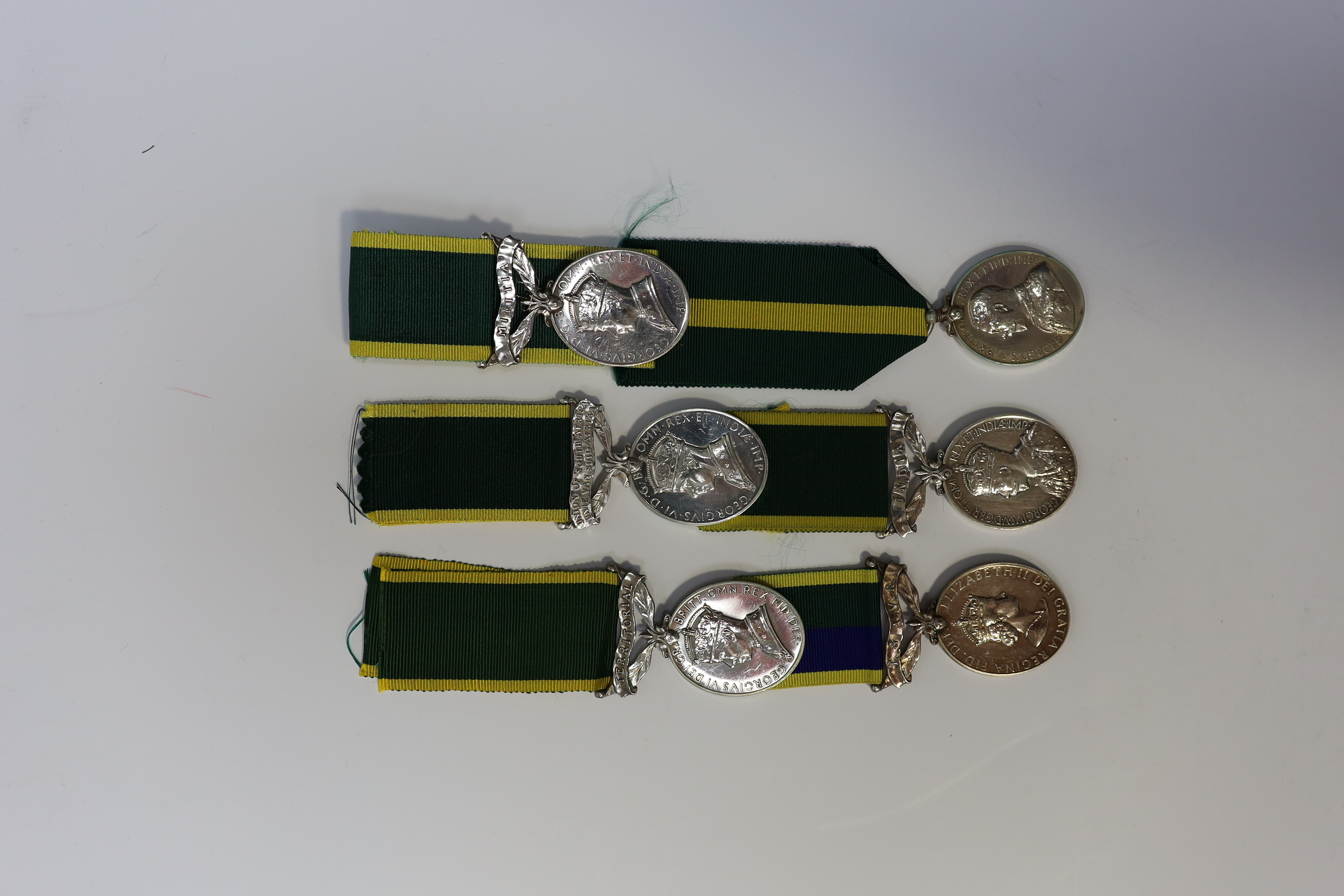 Six assorted Efficiency medals; GV (C) India to Pte.F.S.Slee,1 E.I.RY.R.,A.F.I.;GV (A) Territorial to 477046 Sjt H.W.Pawley, R.A.M.C.; GVI Militia to 2313197 Sclmn.S.H.Dummer, R.Signals.; GVI Territorial to 1434970 Gnr C